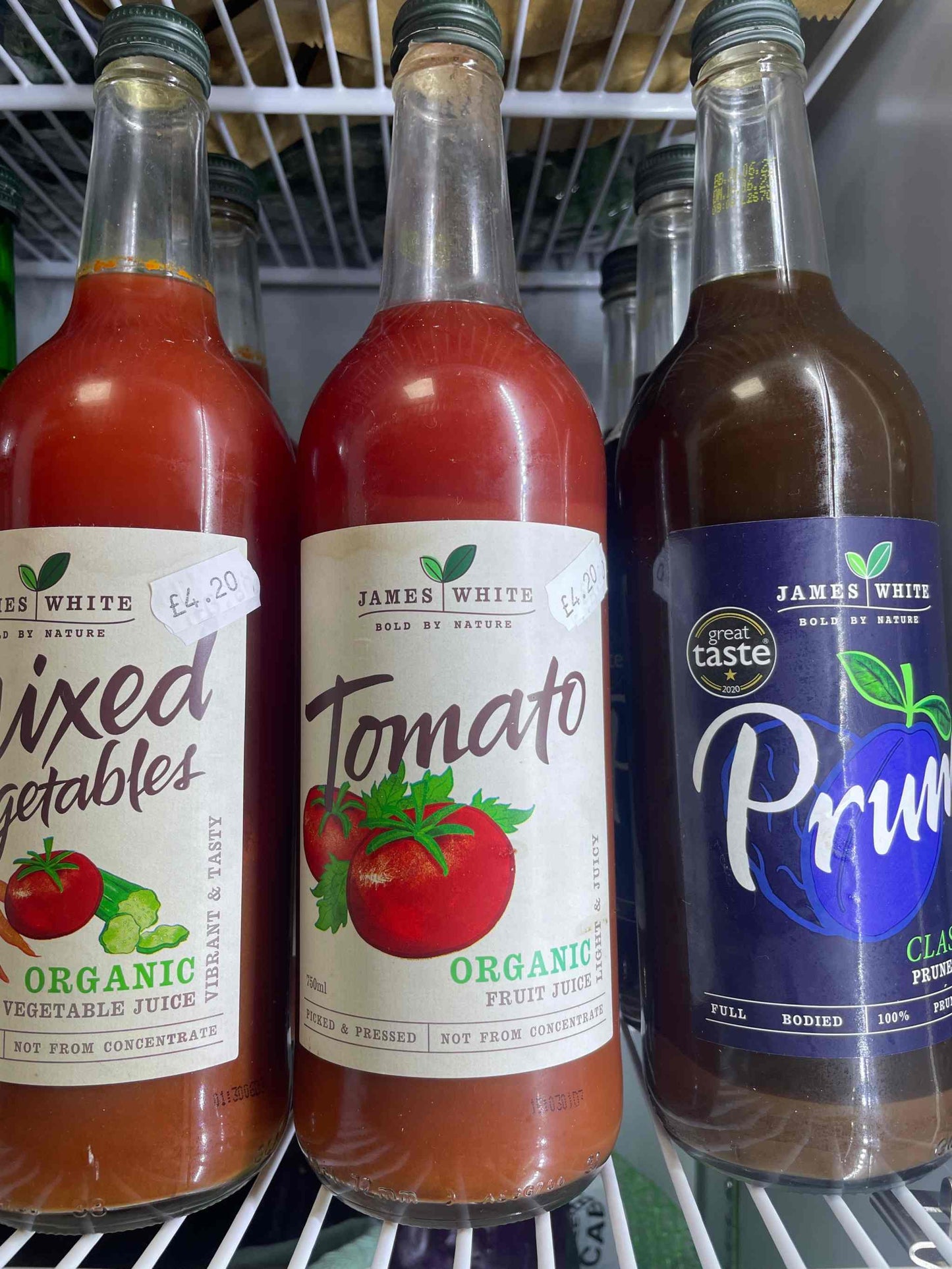 James White Juice - Tomato organic beverage in glass bottle.