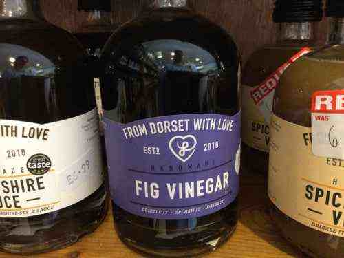 Premium flavoured vinegars from Dorset with love displayed on a shelf, showcasing artisanal craftsmanship.